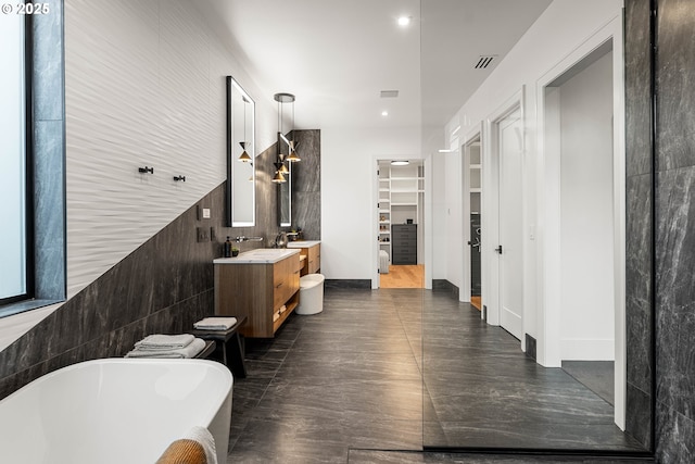 NE 43rd Cir Lot 5, Camas, WA 98607 - bathroom featuring a spacious closet, a freestanding tub, double vanity, and recessed lighting