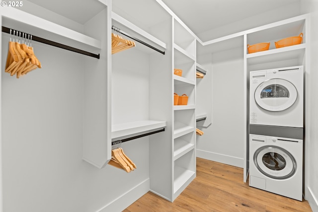 NE 43rd Cir Lot 5, Camas, WA 98607 - washroom with stacked washer / drying machine, light wood-style floors, and baseboards
