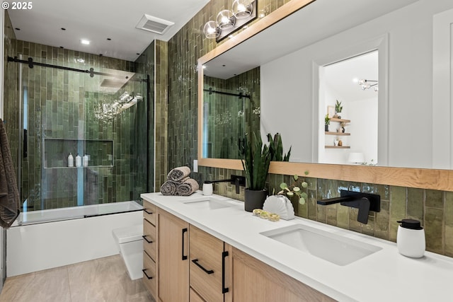 NE 43rd Cir Lot 5, Camas, WA 98607 - bathroom featuring double vanity, toilet, bath / shower combo with glass door, and tasteful backsplash