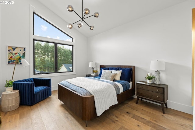 NE 43rd Cir Lot 5, Camas, WA 98607 - bedroom with a chandelier, light wood-style flooring, high vaulted ceiling, and baseboards