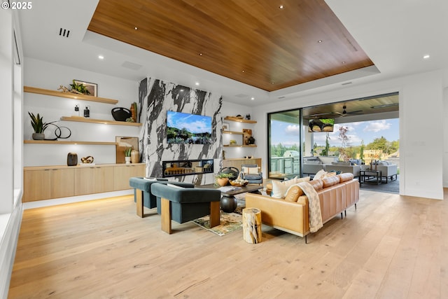 NE 43rd Cir Lot 5, Camas, WA 98607 - living room featuring a raised ceiling, light wood-type flooring, wooden ceiling, a high end fireplace, and recessed lighting
