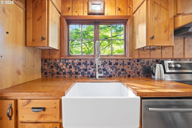 22345 S Poplar Rd, Estacada, OR 97023 - kitchen with stainless steel dishwasher, backsplash, and wooden counters