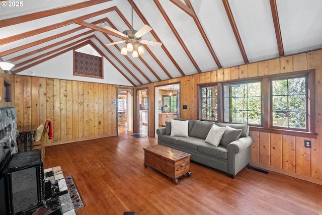 22345 S Poplar Rd, Estacada, OR 97023 - living area with wood walls, plenty of natural light, a fireplace, and wood finished floors