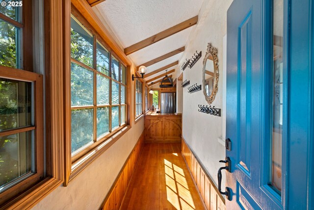 22345 S Poplar Rd, Estacada, OR 97023 - hallway featuring wood finished floors, plenty of natural light, and a textured ceiling