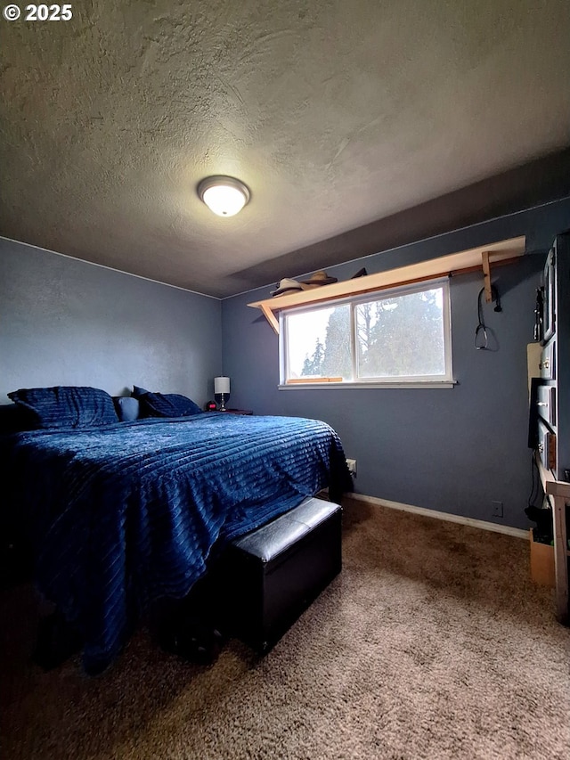 bedroom with carpet flooring and a textured ceiling