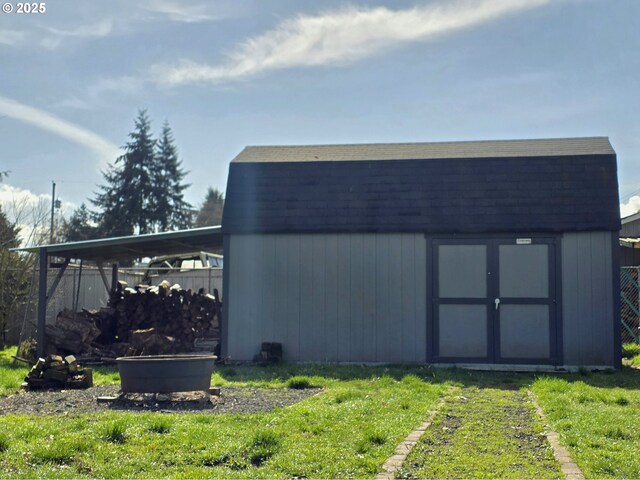 back of house with a lawn