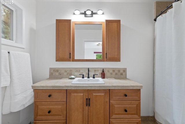 2245 SW Martha St, Portland, OR 97239 - bathroom featuring vanity, tasteful backsplash, and curtained shower