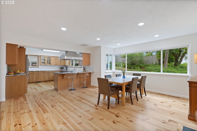 2245 SW Martha St, Portland, OR 97239 - dining room featuring light wood-style floors, recessed lighting, and a textured ceiling