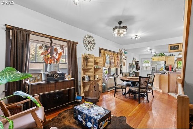 680 S Alfalfa St, Heppner, OR 97836 - dining space featuring light wood-type flooring, a chandelier, and a ceiling fan