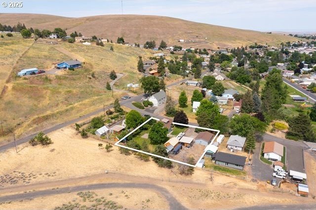 680 S Alfalfa St, Heppner, OR 97836 - aerial perspective of suburban area featuring property parcel outlined and mountains