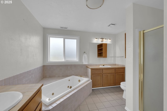 full bathroom with visible vents, vanity, a jetted tub, tile patterned floors, and a stall shower