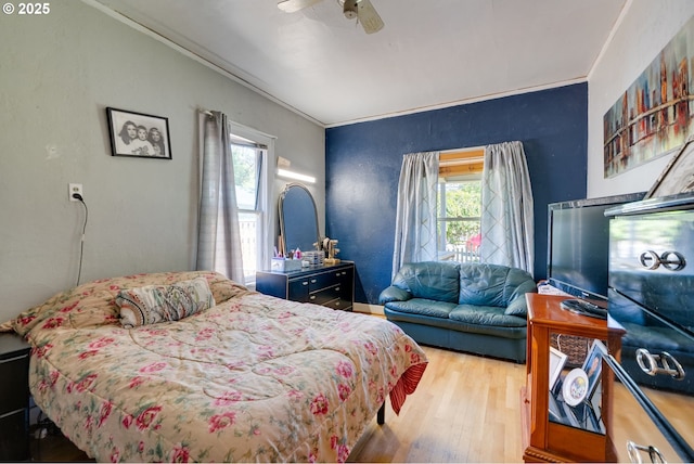 3265 SW 187th Ave, Beaverton, OR 97003 - bedroom featuring multiple windows, wood finished floors, crown molding, and ceiling fan