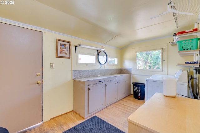 3265 SW 187th Ave, Beaverton, OR 97003 - laundry room with washing machine and dryer, light wood finished floors, and cabinet space