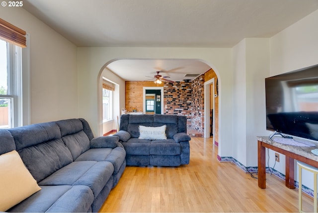 3265 SW 187th Ave, Beaverton, OR 97003 - living room with arched walkways, light wood-type flooring, and ceiling fan