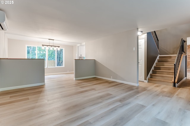 5120 Talisman St, Eugene, OR 97405 - unfurnished room featuring light wood-type flooring, baseboards, stairs, and a chandelier