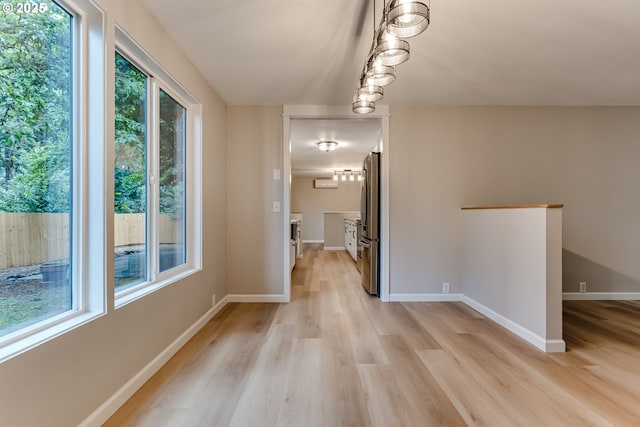 5120 Talisman St, Eugene, OR 97405 - corridor featuring light wood finished floors, baseboards, and an upstairs landing