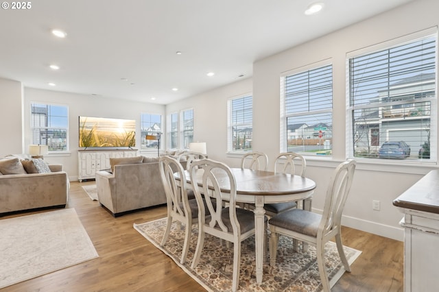 dining space featuring light hardwood / wood-style floors