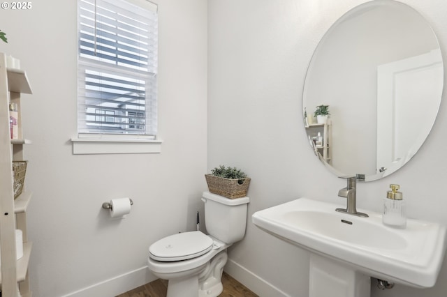 bathroom with toilet and sink