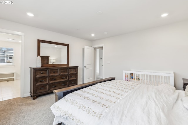 bedroom featuring light carpet