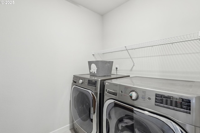 laundry room featuring washer and clothes dryer