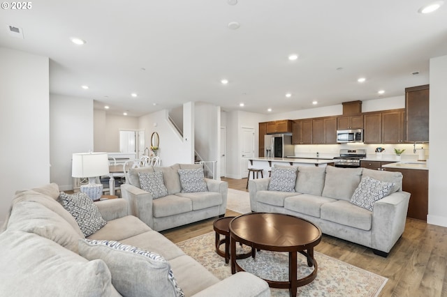 living room with light hardwood / wood-style flooring