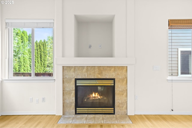 5274 NW Crady Ln, Portland, OR 97229 - detailed view of wood finished floors and a fireplace