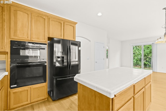 5274 NW Crady Ln, Portland, OR 97229 - kitchen featuring black appliances, tile counters, light wood-style floors, a center island, and recessed lighting