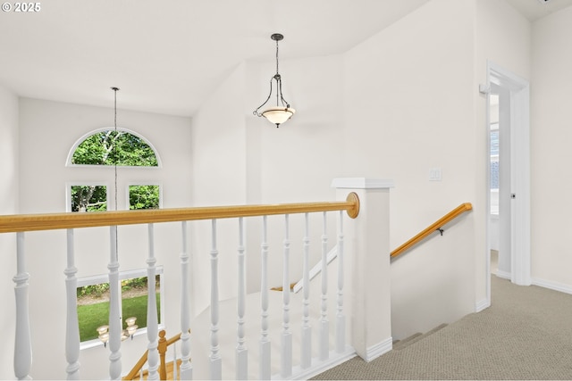 5274 NW Crady Ln, Portland, OR 97229 - hallway featuring an upstairs landing, carpet flooring, and lofted ceiling