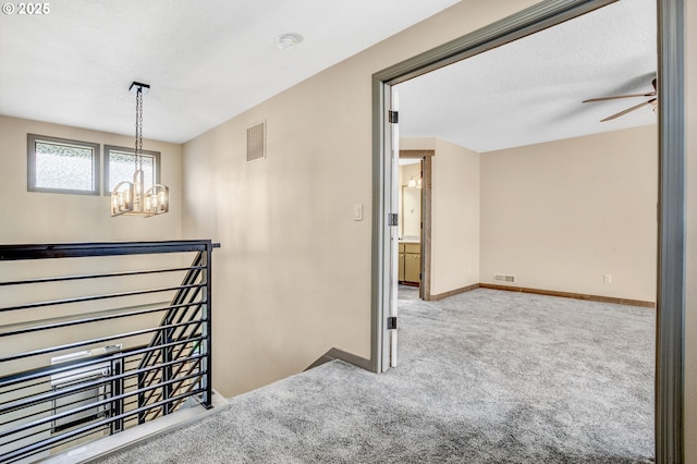 3017 SE Brookwood Ave, Hillsboro, OR 97123 - hall featuring an upstairs landing, carpet, a chandelier, and baseboards