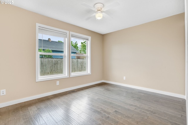 3017 SE Brookwood Ave, Hillsboro, OR 97123 - spare room featuring ceiling fan, wood finished floors, and baseboards