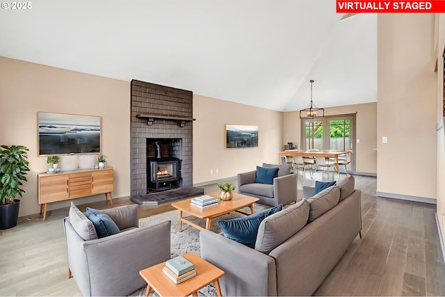 3017 SE Brookwood Ave, Hillsboro, OR 97123 - living area with wood finished floors, baseboards, and high vaulted ceiling