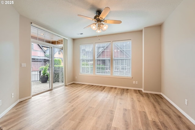799 NE 70th Ave, Hillsboro, OR 97124 - spare room with light wood-style flooring, a ceiling fan, and baseboards