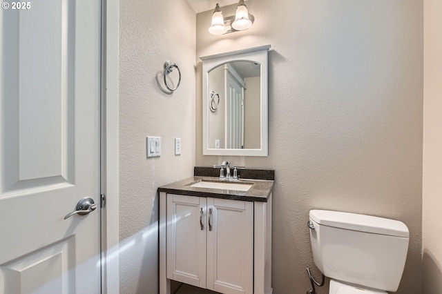 799 NE 70th Ave, Hillsboro, OR 97124 - bathroom featuring vanity, toilet, and a textured wall