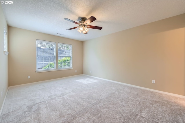 799 NE 70th Ave, Hillsboro, OR 97124 - carpeted spare room with a ceiling fan, a textured ceiling, and baseboards