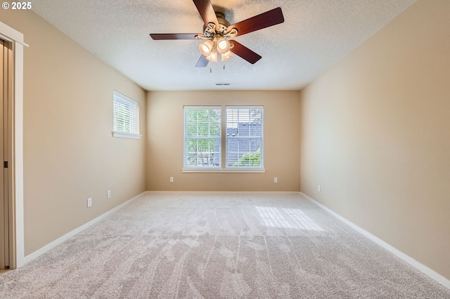 799 NE 70th Ave, Hillsboro, OR 97124 - empty room with light colored carpet, ceiling fan, a textured ceiling, and baseboards