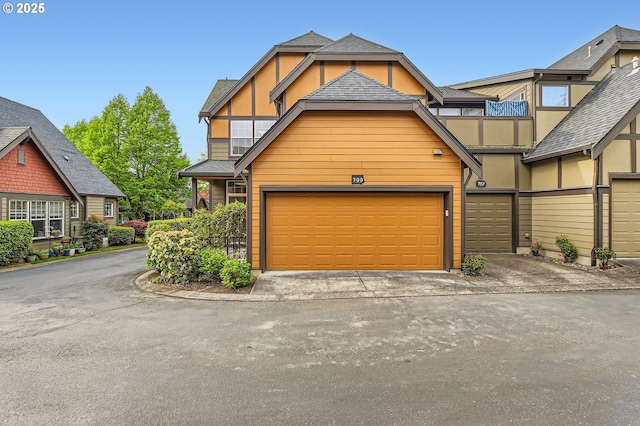 799 NE 70th Ave, Hillsboro, OR 97124 - view of front of house with driveway and stucco siding