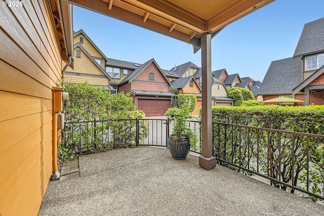 799 NE 70th Ave, Hillsboro, OR 97124 - view of patio featuring a residential view and a garage