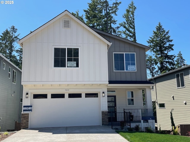 7839 SW Thornbridge Ter Unit 10, Beaverton, OR 97007 - view of front of home featuring board and batten siding, covered porch, an attached garage, and driveway