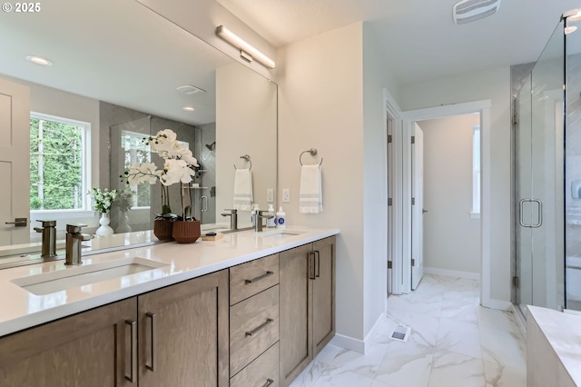 7839 SW Thornbridge Ter Unit 10, Beaverton, OR 97007 - bathroom featuring double vanity, marble finish flooring, baseboards, a stall shower, and recessed lighting