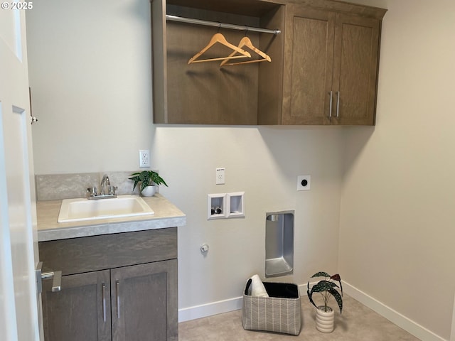 7839 SW Thornbridge Ter Unit 10, Beaverton, OR 97007 - laundry area featuring cabinet space, electric dryer hookup, washer hookup, and baseboards