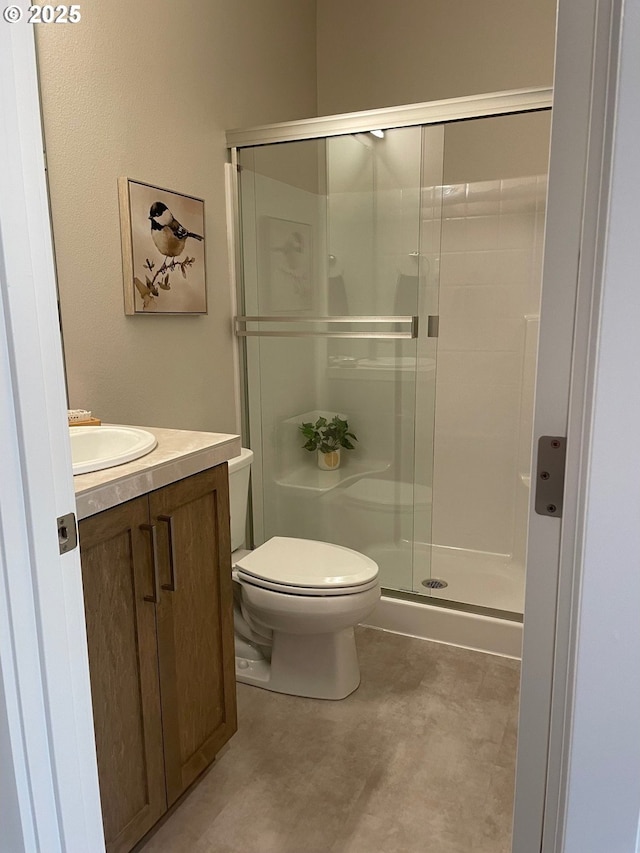 7839 SW Thornbridge Ter Unit 10, Beaverton, OR 97007 - full bathroom featuring toilet, a stall shower, vanity, and concrete flooring