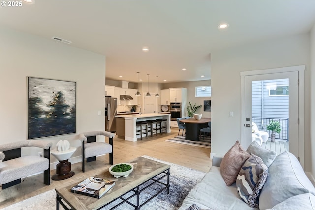 7839 SW Thornbridge Ter Unit 10, Beaverton, OR 97007 - living room with light wood finished floors and recessed lighting