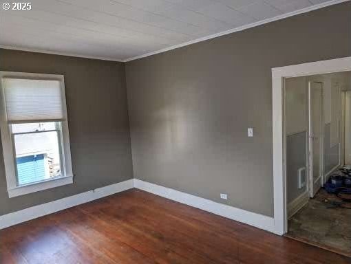 315 W Marine Dr, Astoria, OR 97103 - spare room featuring crown molding, baseboards, and wood finished floors