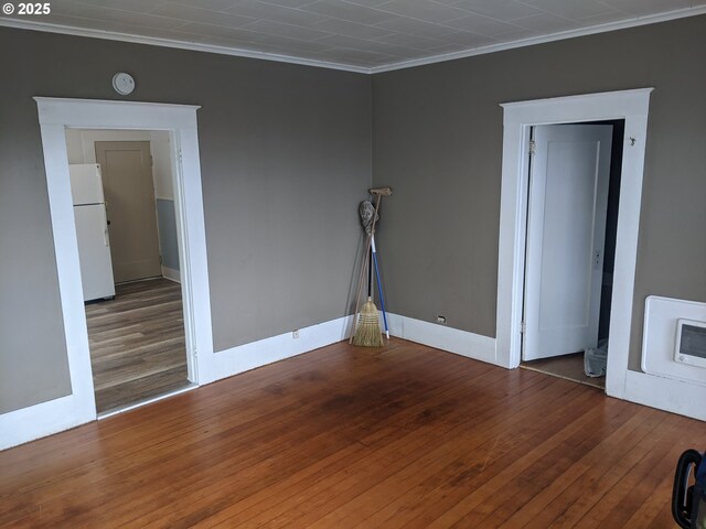 315 W Marine Dr, Astoria, OR 97103 - spare room with ornamental molding, wood finished floors, baseboards, and a smoke detector