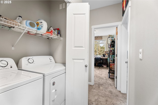 laundry room featuring light colored carpet and washing machine and clothes dryer