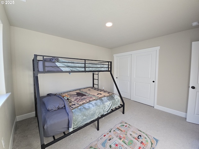 bedroom with a closet and carpet