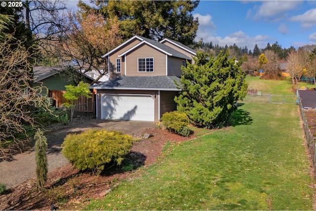 traditional home featuring fence, driveway, roof with shingles, a front lawn, and a garage