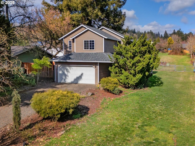 view of front of house with a garage, driveway, fence, and a front lawn