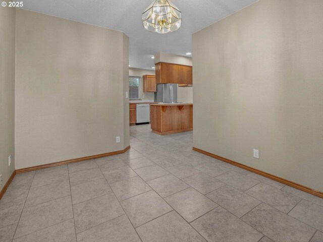 unfurnished living room featuring light tile patterned flooring, an inviting chandelier, baseboards, and recessed lighting