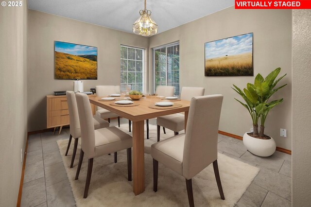 unfurnished room featuring light tile patterned floors and an inviting chandelier